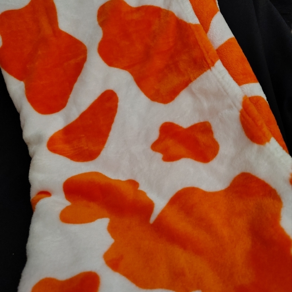 Orange and White Cow Print Blanket